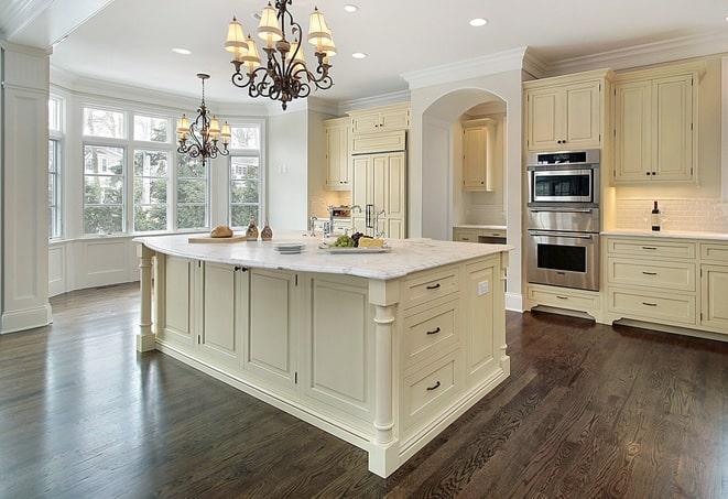 close-up of hand scraping laminate floors in Bay Pines